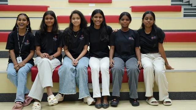 Students on a red bench