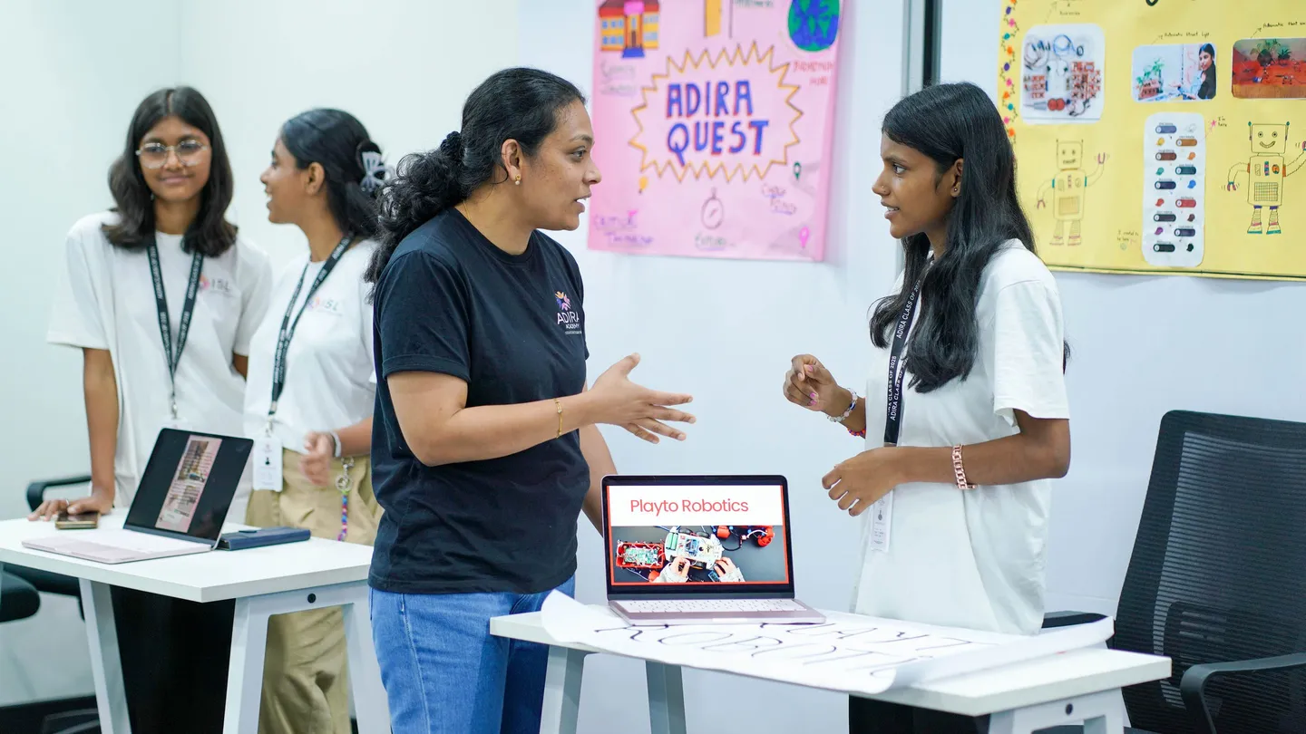 A student showing her robotics project