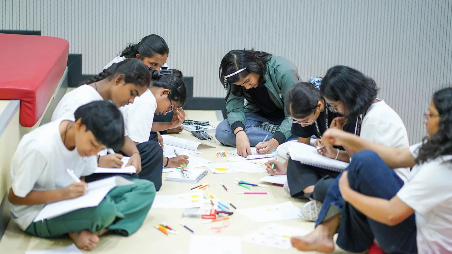 Students drawing and writing