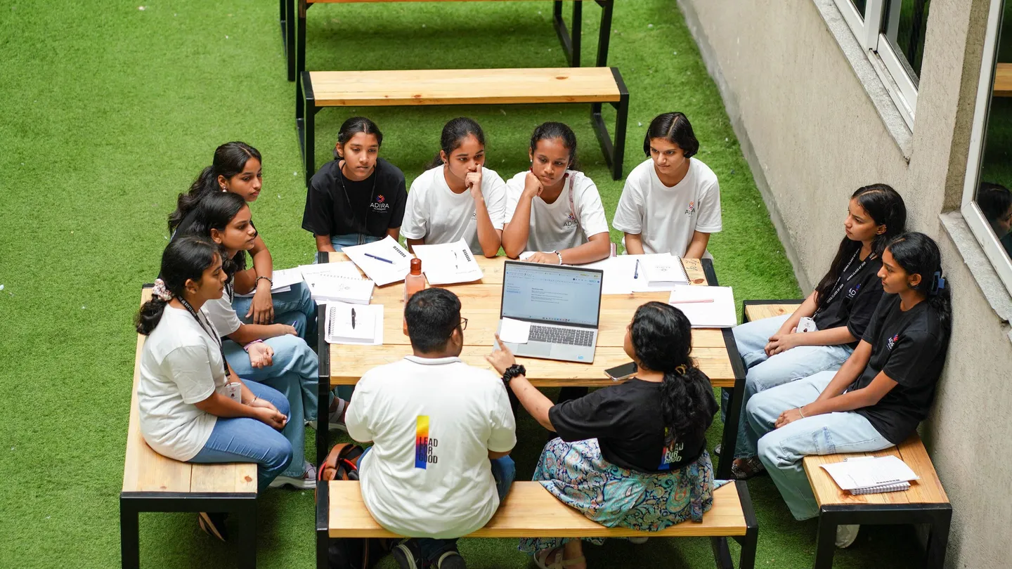 Students talking with two adults