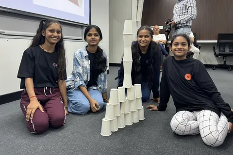 Students with the cup tower they built